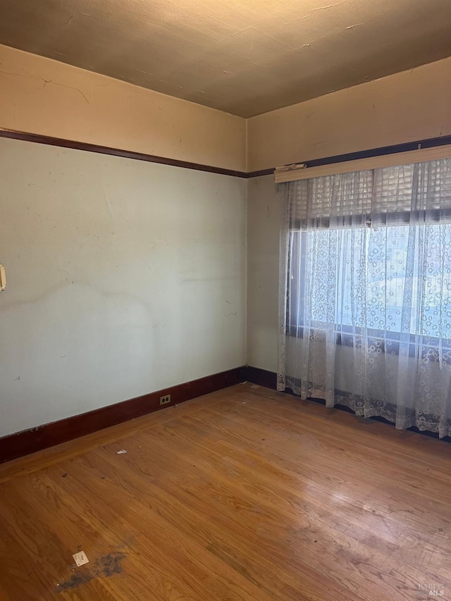 718 Monterey St, Vallejo, CA 94590 - unfurnished room with wood finished floors and baseboards