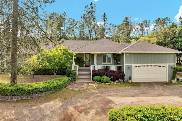 15625 June Bug Rd, Lower Lake, CA 95453 - view of front of house featuring driveway, a porch, a shingled roof, an attached garage, and stairway