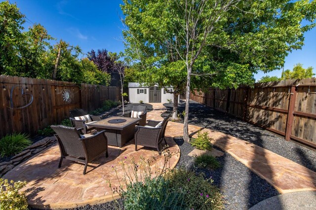 1024 Feather River Ct, Vacaville, CA 95688 - fenced backyard featuring a patio area and an outdoor fire pit