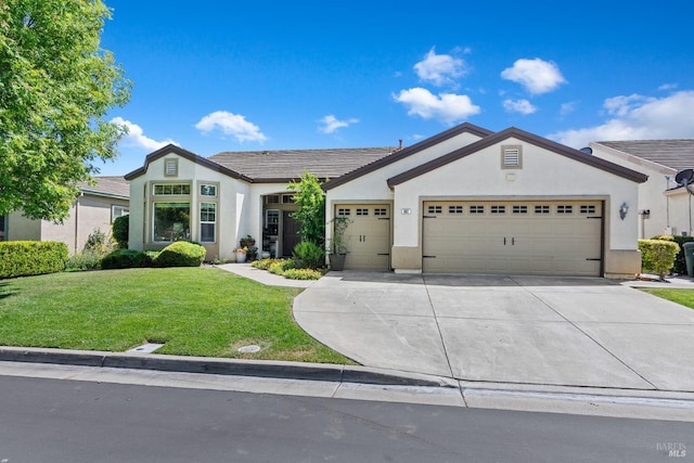 602 Summerset Dr, Rio Vista, CA 94571 - ranch-style home with stucco siding, a garage, concrete driveway, and a front yard