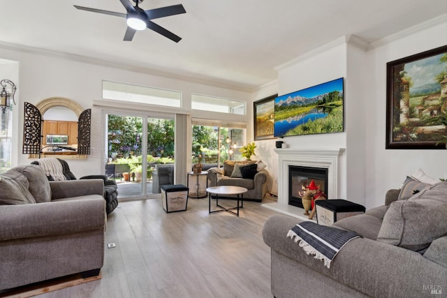 602 Summerset Dr, Rio Vista, CA 94571 - living area featuring ornamental molding, a glass covered fireplace, wood finished floors, and ceiling fan