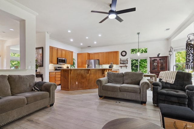 602 Summerset Dr, Rio Vista, CA 94571 - living room featuring light wood-style floors, a ceiling fan, recessed lighting, and crown molding