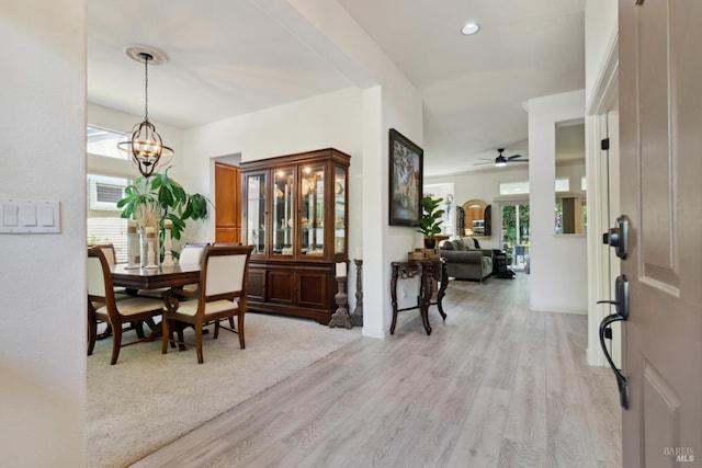 602 Summerset Dr, Rio Vista, CA 94571 - dining space with healthy amount of natural light, light wood finished floors, a chandelier, and a ceiling fan