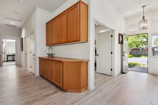 602 Summerset Dr, Rio Vista, CA 94571 - hallway featuring light wood-style flooring, plenty of natural light, a chandelier, and baseboards