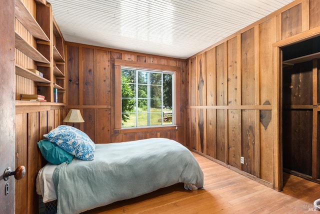 10520 Hwy 116, Forestville, CA 95436 - bedroom featuring wood walls and wood-type flooring