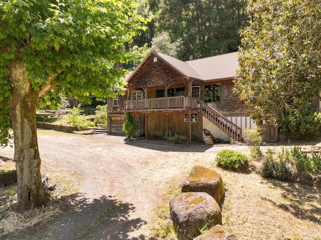 10520 Hwy 116, Forestville, CA 95436 - rustic home featuring stairs, driveway, a garage, a deck, and roof with shingles