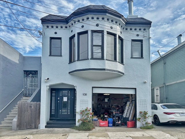 108 Naglee Ave, San Francisco, CA 94112 - view of front of property with stucco siding and an attached garage