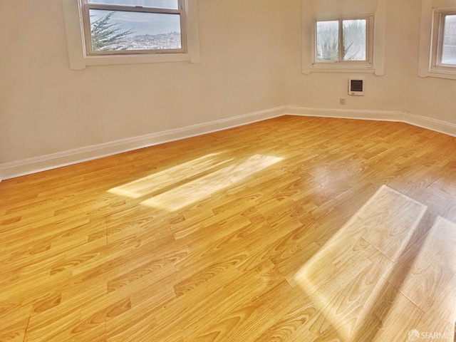 108 Naglee Ave, San Francisco, CA 94112 - spare room with baseboards, wood finished floors, and heating unit
