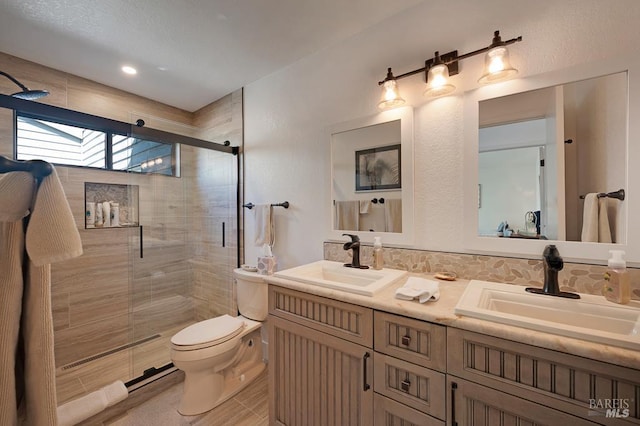 21199 Hummingbird Ct, Bodega Bay, CA 94923 - bathroom featuring double vanity, a stall shower, and toilet