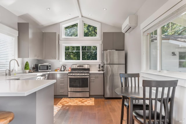 4223 Silverado Trl, Napa, CA 94558 - kitchen featuring appliances with stainless steel finishes, gray cabinetry, a wall unit AC, and a sink