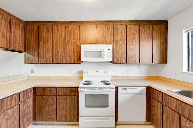 53 Monte Cresta Ave, Pleasant Hill, CA 94523 - kitchen with white appliances, light countertops, and brown cabinets