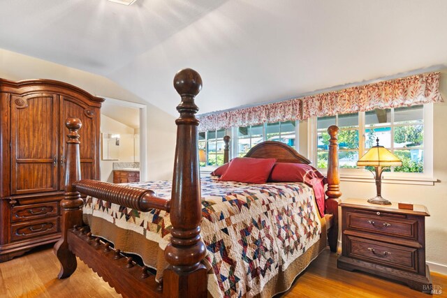 117 Farallon Dr, Vallejo, CA 94590 - bedroom featuring light wood finished floors, lofted ceiling, and ensuite bath