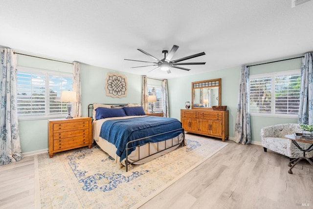 420 Georgetown Pl, Dixon, CA 95620 - bedroom with multiple windows, wood finished floors, baseboards, and ceiling fan