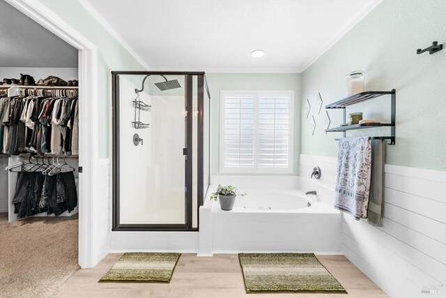 420 Georgetown Pl, Dixon, CA 95620 - full bath with a shower stall, ornamental molding, a tub with jets, a spacious closet, and wood finished floors
