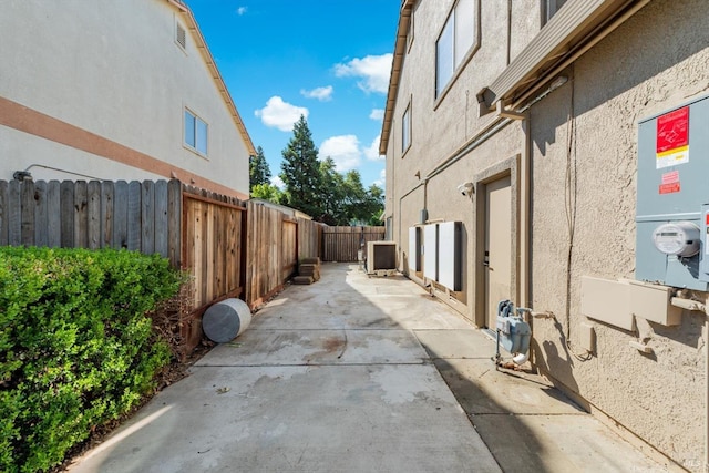 420 Georgetown Pl, Dixon, CA 95620 - view of home's exterior with stucco siding, a patio, a fenced backyard, and central AC
