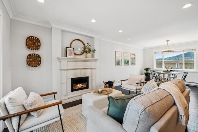 490 S Eliseo Dr, Greenbrae, CA 94904 - living area with wood finished floors, recessed lighting, ornamental molding, a tiled fireplace, and baseboards