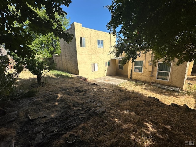 942 Benicia Rd, Vallejo, CA 94591 - back of property featuring stucco siding and a patio