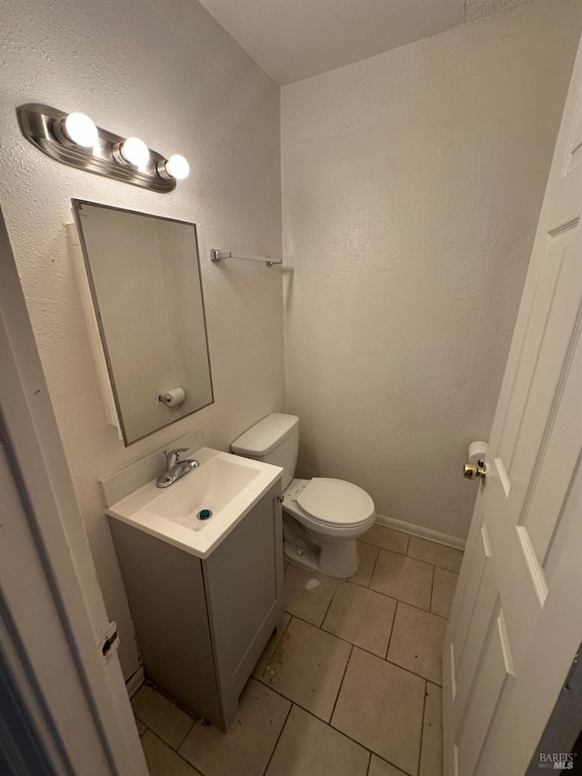 942 Benicia Rd, Vallejo, CA 94591 - bathroom featuring vanity, toilet, and tile patterned flooring