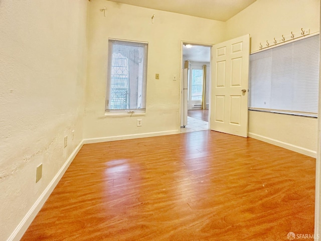 1927 Taraval St, San Francisco, CA 94116 - spare room with baseboards, wood finished floors, and a baseboard heating unit