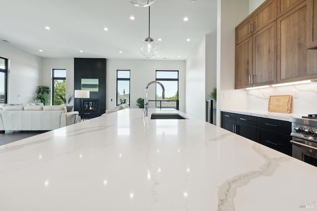 3704 Llyn Glaslyn Pl, Santa Rosa, CA 95403 - kitchen with recessed lighting, healthy amount of natural light, open floor plan, a sink, and a fireplace