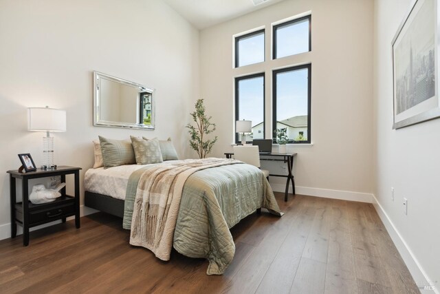 3704 Llyn Glaslyn Pl, Santa Rosa, CA 95403 - bedroom featuring wood finished floors, baseboards, a towering ceiling, and an office area
