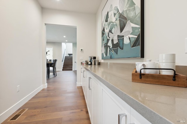 3704 Llyn Glaslyn Pl, Santa Rosa, CA 95403 - bar area featuring wood finished floors, stairway, recessed lighting, and baseboards