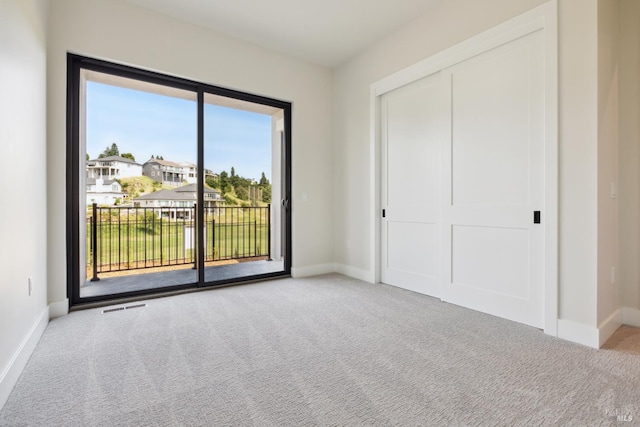 3704 Llyn Glaslyn Pl, Santa Rosa, CA 95403 - unfurnished bedroom with access to outside, carpet, baseboards, and a closet