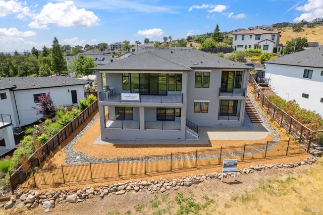 3704 Llyn Glaslyn Pl, Santa Rosa, CA 95403 - rear view of house with a fenced backyard, a residential view, and stucco siding