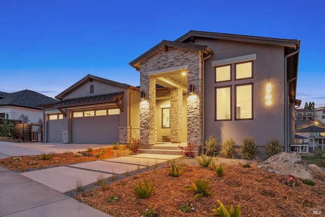 3704 Llyn Glaslyn Pl, Santa Rosa, CA 95403 - view of front of property featuring stone siding, stucco siding, an attached garage, driveway, and a standing seam roof