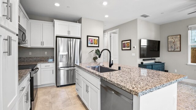 1212 Del Rancho Way, Petaluma, CA 94954 - kitchen featuring stainless steel appliances, a sink, recessed lighting, white cabinetry, and an island with sink