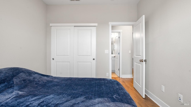 1212 Del Rancho Way, Petaluma, CA 94954 - bedroom with light wood-style floors, baseboards, and a closet