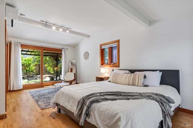10 Waldruhe Hts, Glen Ellen, CA 95442 - bedroom featuring access to outside, light wood-style floors, rail lighting, and a wall mounted air conditioner