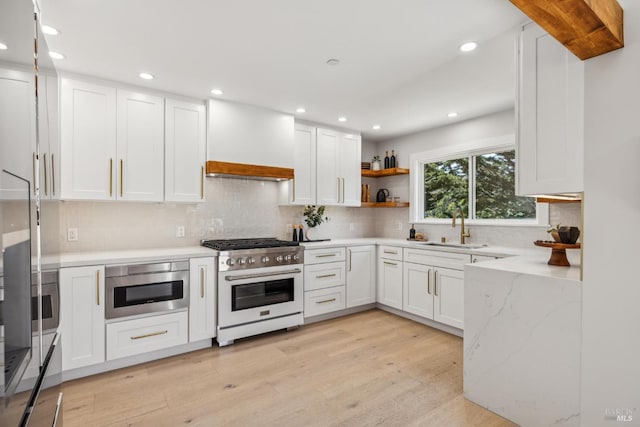 532 Pine Crest Rd, Mill Valley, CA 94941 - kitchen with stainless steel stove, a sink, custom range hood, open shelves, and light stone countertops