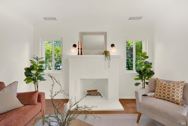 1645 Georgia St, Napa, CA 94559 - living room featuring plenty of natural light, a brick fireplace, and baseboards