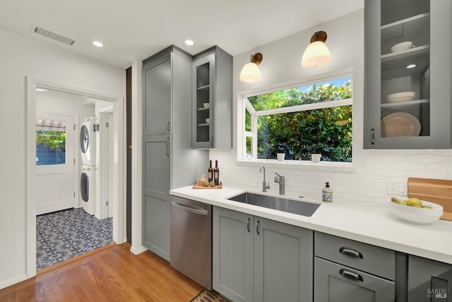 1645 Georgia St, Napa, CA 94559 - kitchen with gray cabinetry, stacked washer / dryer, dishwasher, a sink, and light countertops