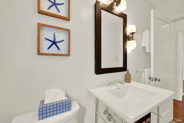 1645 Georgia St, Napa, CA 94559 - bathroom featuring a sink, toilet, and wood finished floors