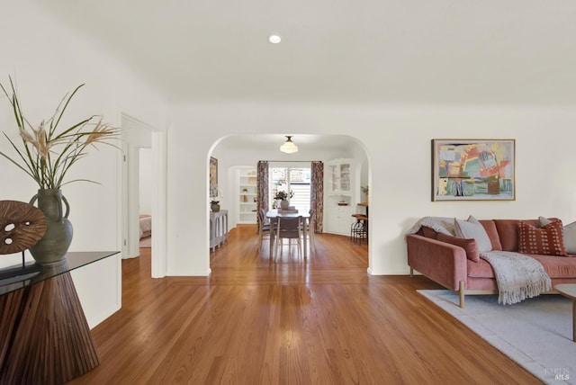 1645 Georgia St, Napa, CA 94559 - living room featuring arched walkways, light wood finished floors, and recessed lighting