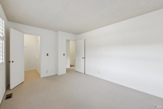 38 Plumas Cir, Novato, CA 94947 - unfurnished bedroom featuring light colored carpet, a spacious closet, and a closet