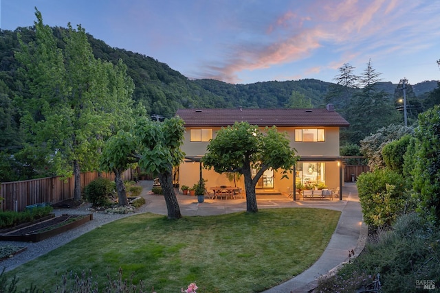 522 Blackstone Dr, San Rafael, CA 94903 - rear view of property featuring a patio, stucco siding, a mountain view, a chimney, and a view of trees