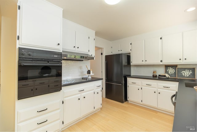 522 Blackstone Dr, San Rafael, CA 94903 - kitchen with black appliances, decorative backsplash, dark countertops, and light wood-style flooring