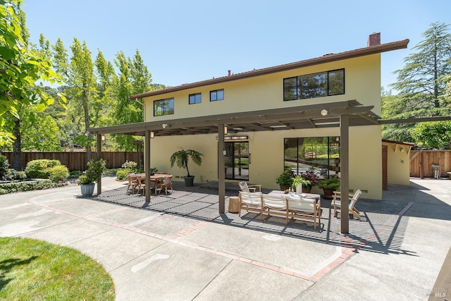 522 Blackstone Dr, San Rafael, CA 94903 - back of house featuring stucco siding, a patio, a chimney, and outdoor dining area