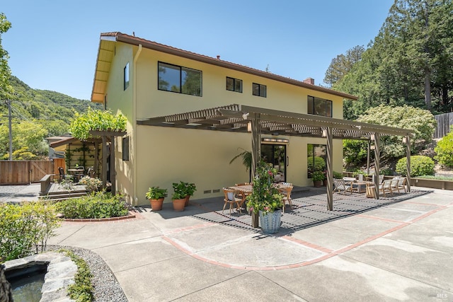 522 Blackstone Dr, San Rafael, CA 94903 - back of property featuring stucco siding, a pergola, a patio, and an outdoor hangout area