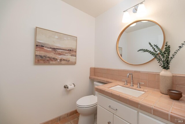 522 Blackstone Dr, San Rafael, CA 94903 - half bathroom featuring vanity, toilet, tile patterned floors, decorative backsplash, and baseboards