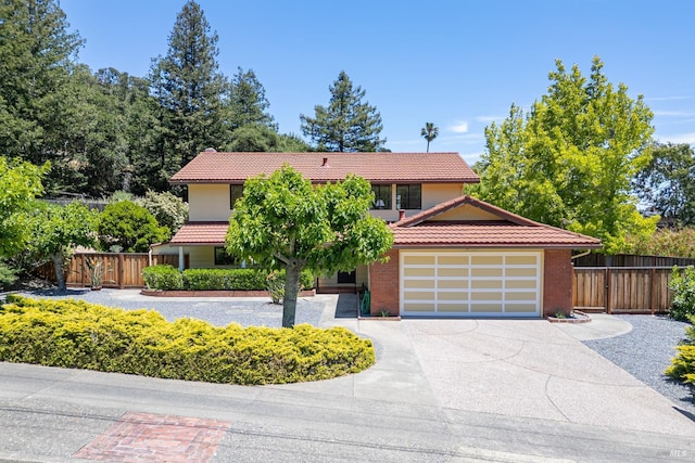 522 Blackstone Dr, San Rafael, CA 94903 - view of front of home with a tiled roof, concrete driveway, and an attached garage
