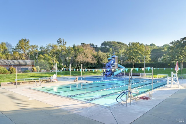 522 Blackstone Dr, San Rafael, CA 94903 - community pool with a water slide, a lawn, and view of scattered trees