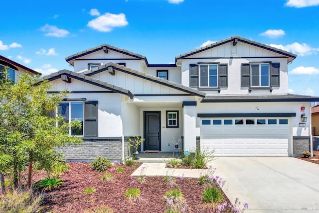 544 Oakham Dr, Vacaville, CA 95687 - view of front of property with concrete driveway, an attached garage, a tile roof, stone siding, and board and batten siding