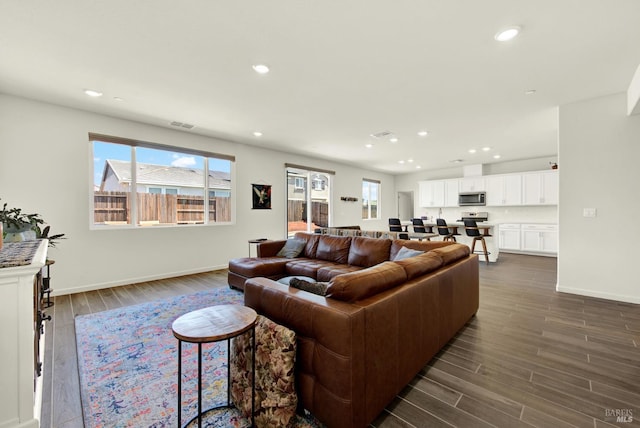 544 Oakham Dr, Vacaville, CA 95687 - living room featuring dark wood-style flooring, recessed lighting, and baseboards