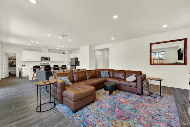 544 Oakham Dr, Vacaville, CA 95687 - living area with wood finish floors, recessed lighting, and baseboards