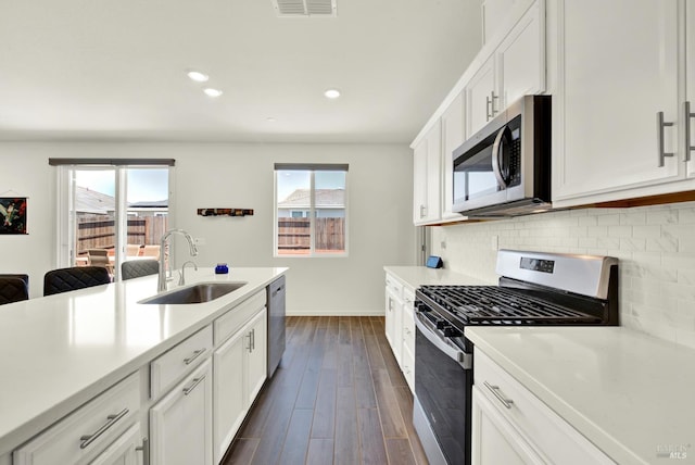 544 Oakham Dr, Vacaville, CA 95687 - kitchen featuring appliances with stainless steel finishes, a sink, plenty of natural light, backsplash, and recessed lighting