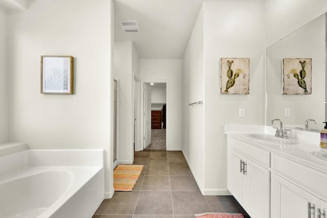 544 Oakham Dr, Vacaville, CA 95687 - full bathroom with tile patterned flooring, vanity, a garden tub, and baseboards